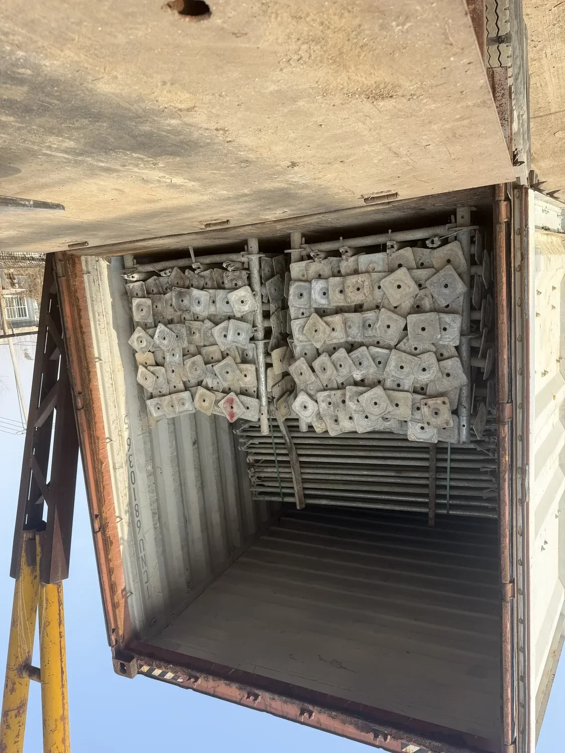 Ringlock scaffolding bundles loaded inside a shipping container